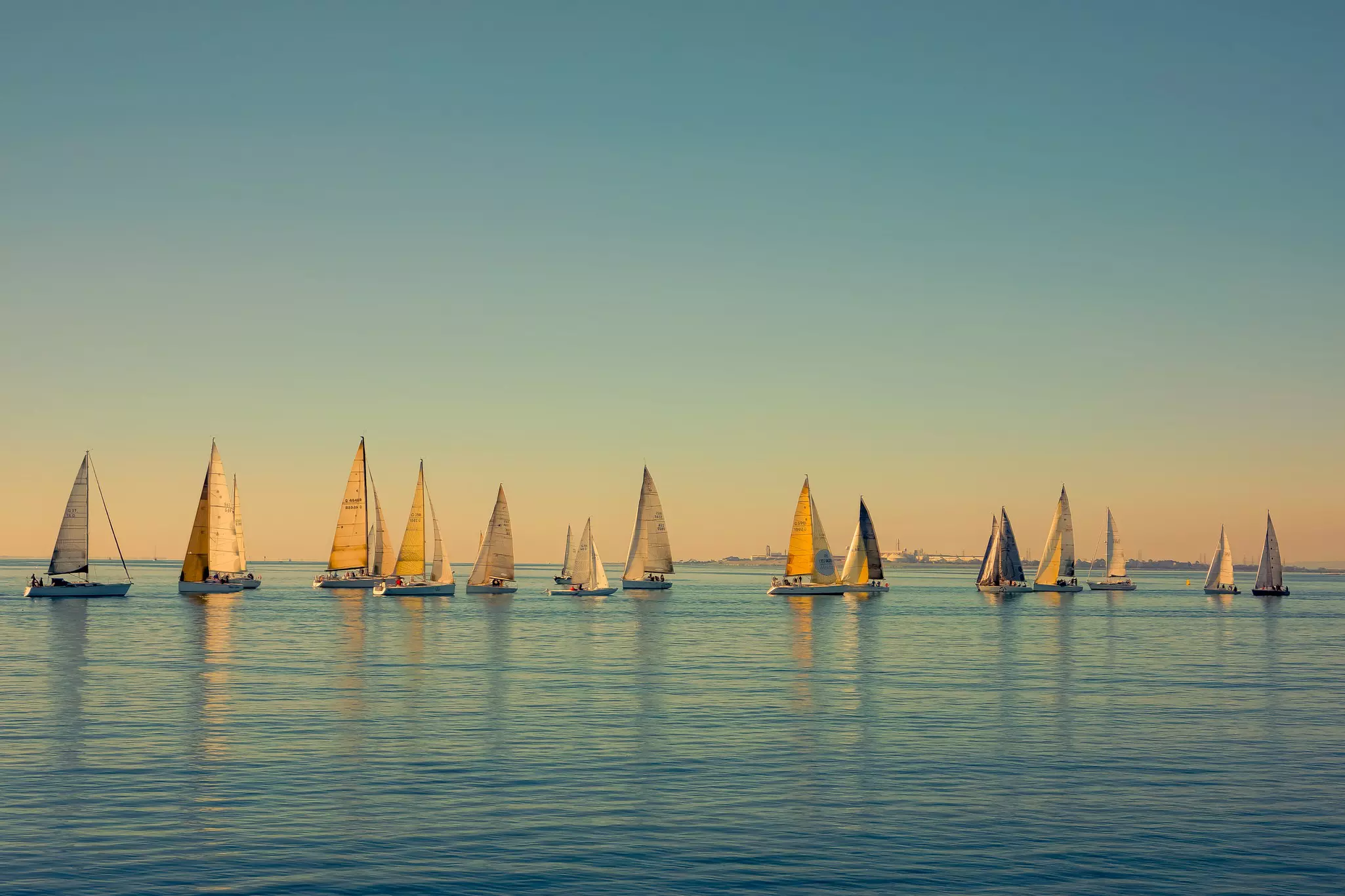 Sailboats scattered on the ocean, seen from The Pier in Geelong, Australia