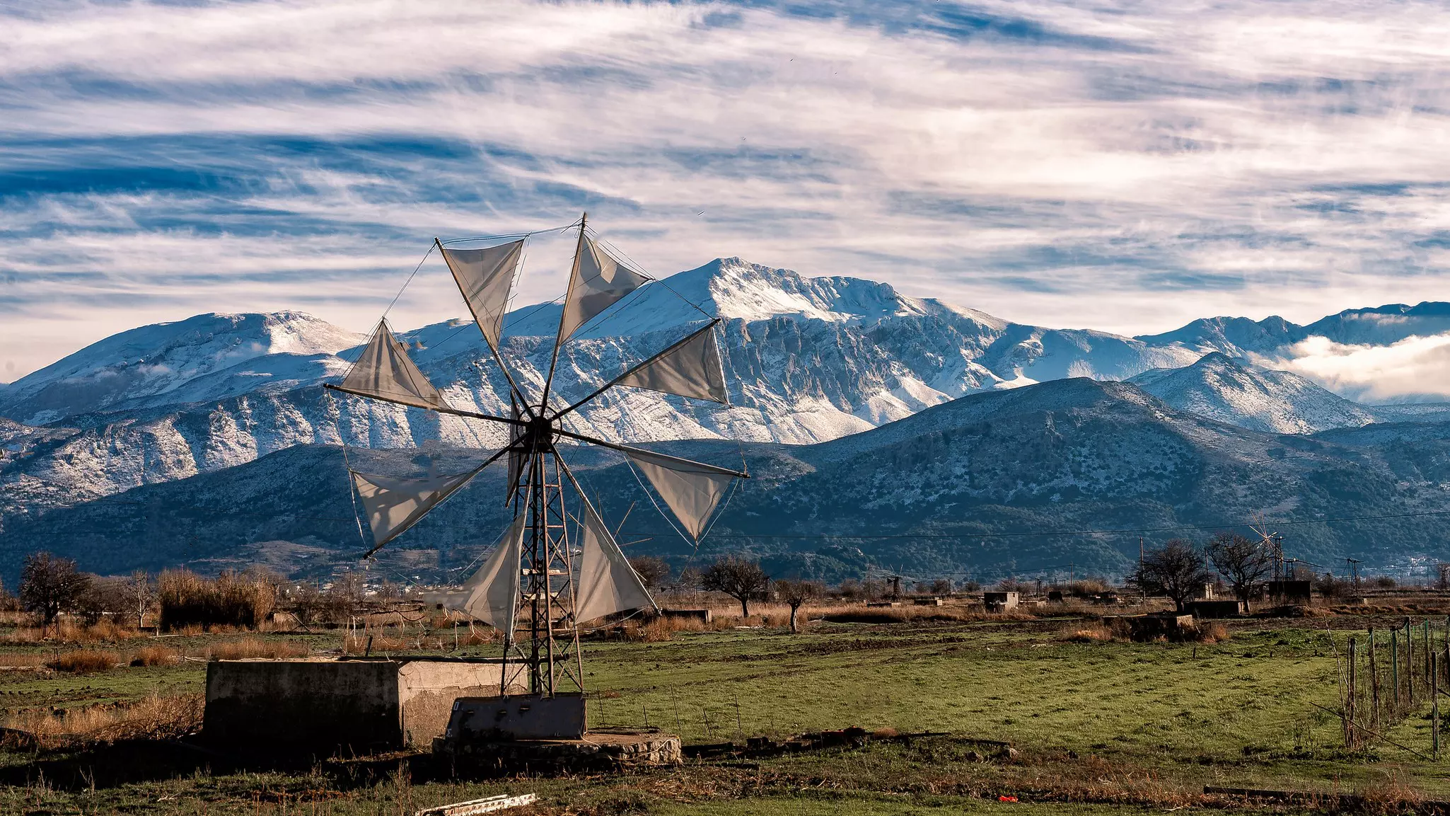 View of a windmill on the Lasithi Plateau in Crete, Greece.