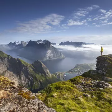 Man stands on the end of a rocky outcrop in Lofoten during sunrise.
1033302478
Sun, Awe, North, People, Sunset, Mountain Peak, Journey, Norway, Mountain Range, Sunrise - Dawn, Northern Europe, Scenics - Nature, Water, Idyllic, Beauty In Nature, Fjord, Lofoten, Non-Urban Scene, Cloud - Sky, Northern Norway, Sea, Sky, Beauty, Sunlight, Mountain, Travel, Coastline, Outdoors, Nature, Hiking, Dreamlike, Majestic, Island, Vacations, Photography, Road Trip, Adventure, Summer, Discovery, Landscape - Scenery, Travel Destinations, Horizontal, One Person, Lofoten and Vesteral Islands, Color Image, Photograph