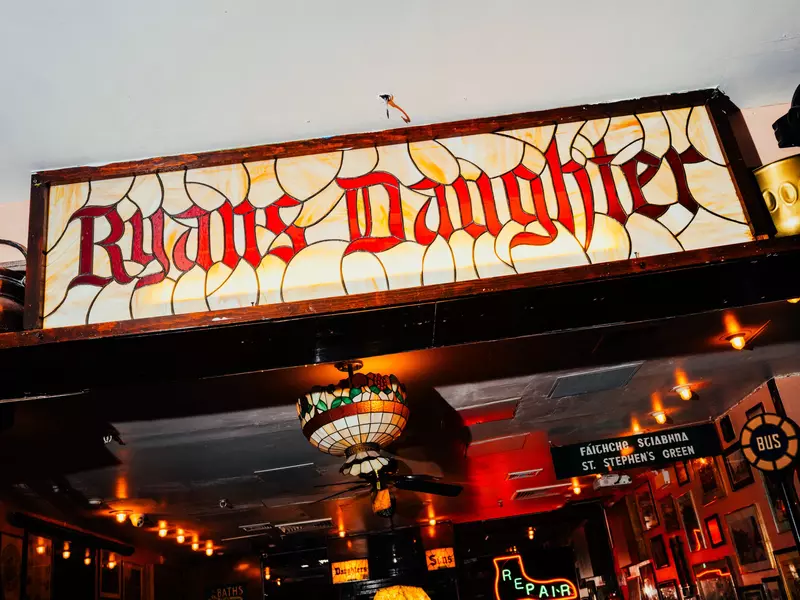 Stained glass sign that reads Ryans Daughter 