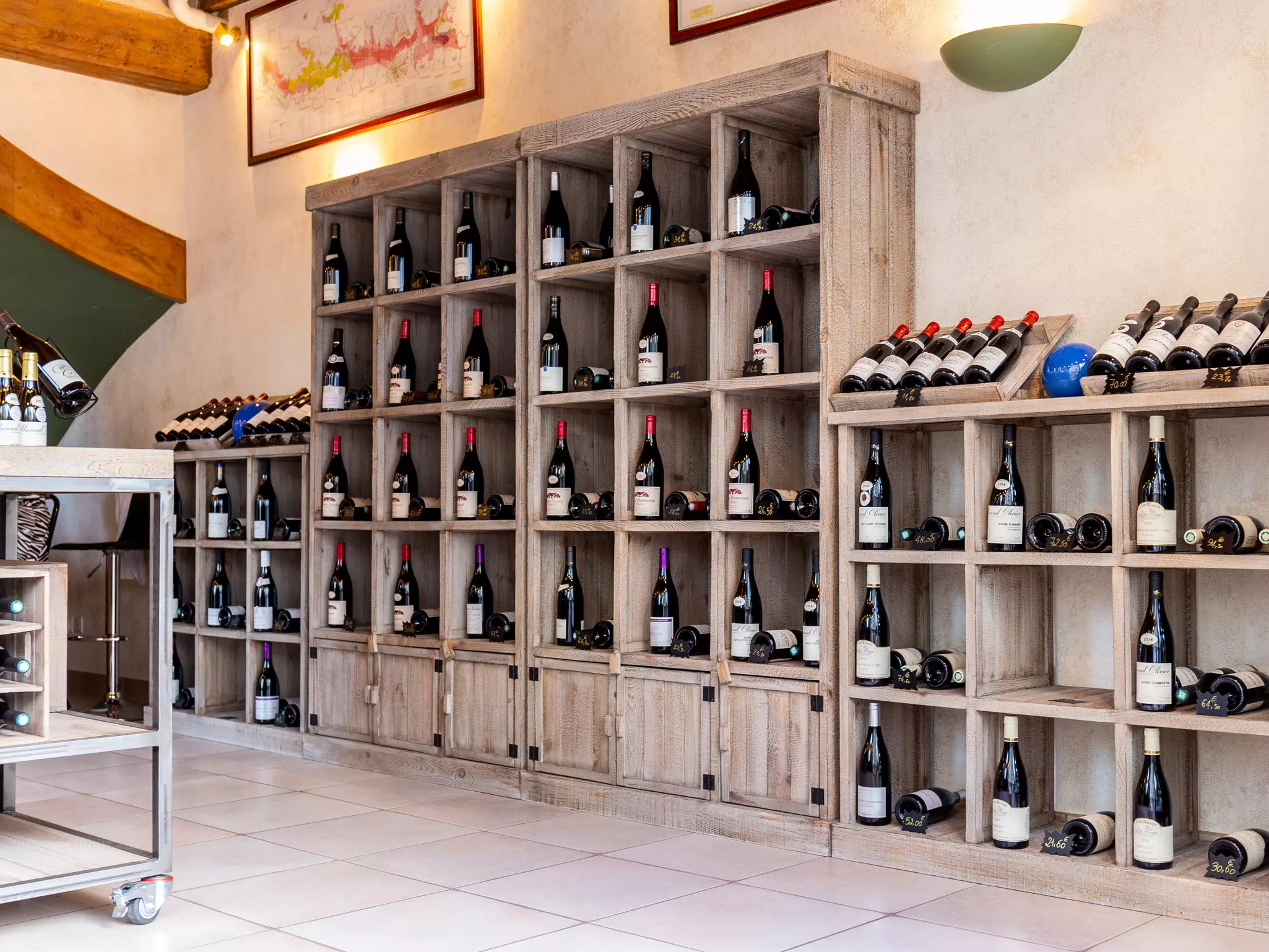 Wine bottles sit on shelves in the tasting room of a winery.