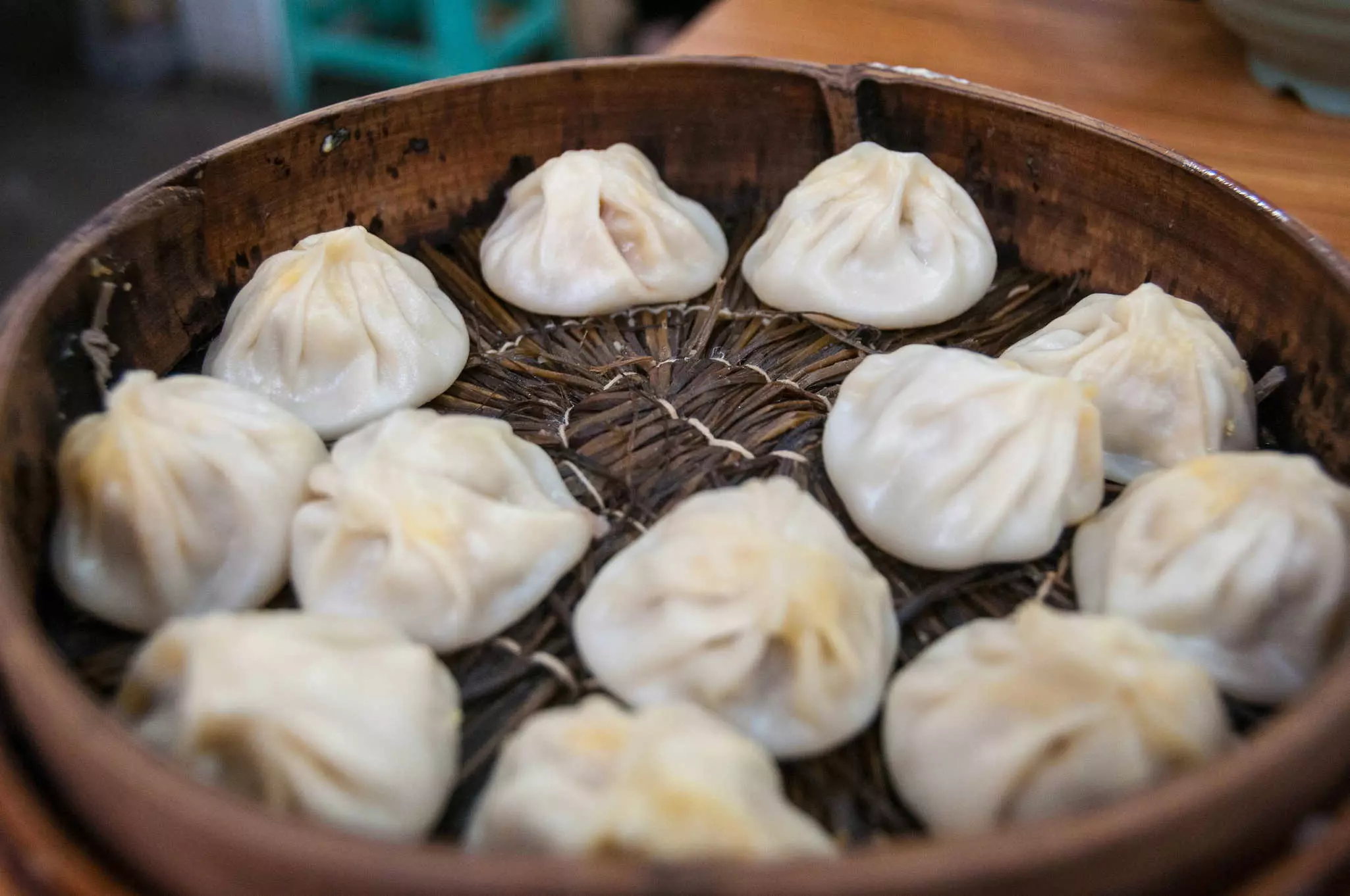 A basket of steamed xiao long bao soup dumplings at Jia Jia Tang Bao on Shanghai's Huanghe Road