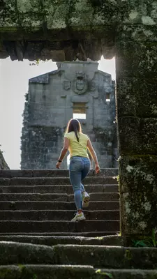 Estefanía Gonzalez leads the way through a ruin in the Fragas do Eume.