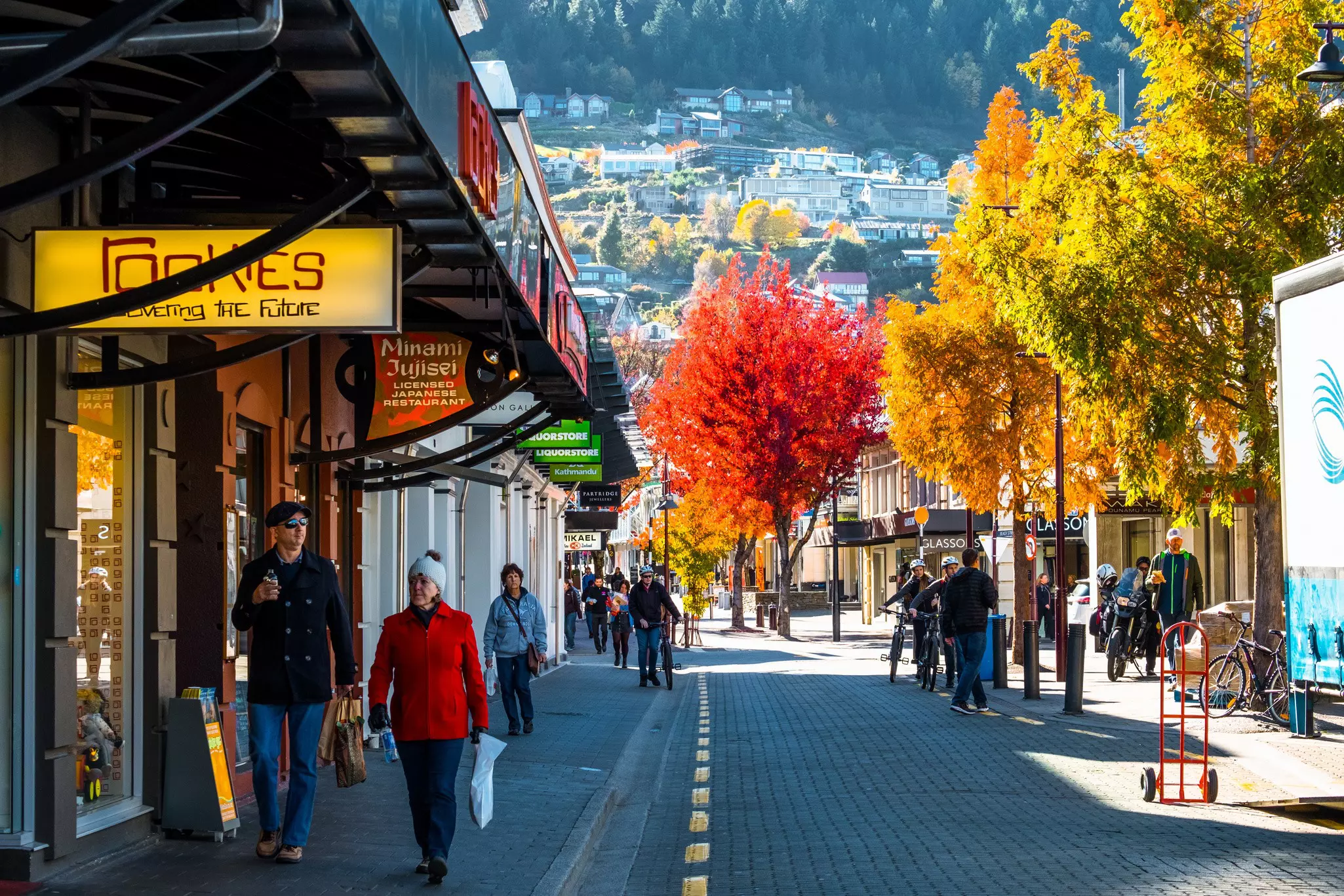 Queenstown, New Zealand, People and the town after sunset.