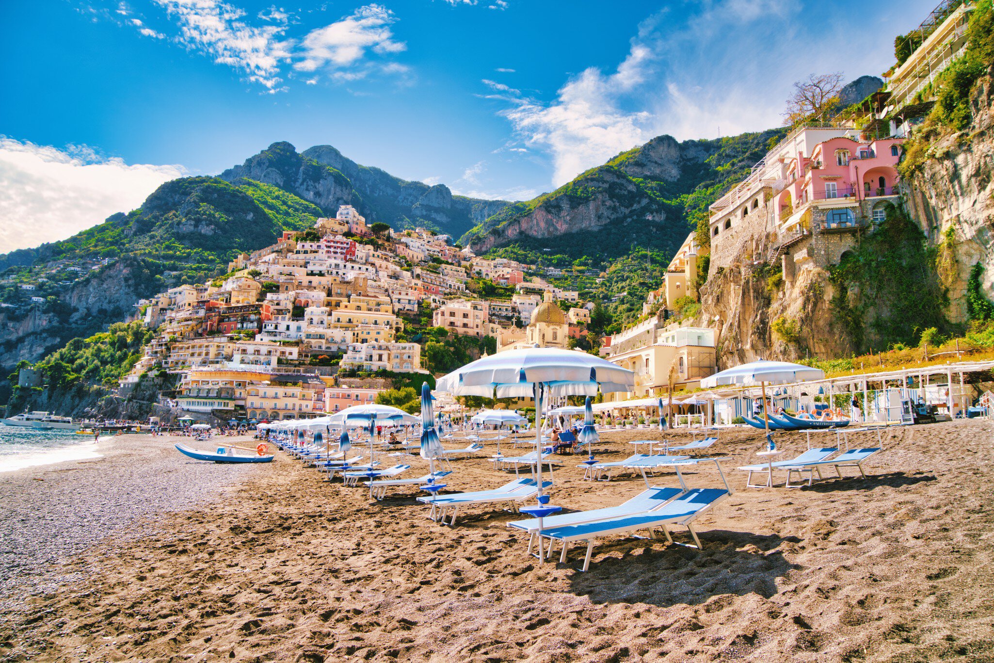 Looking at the beach of the famous village of Positano on the Amalfi coast. Many of the small villages along the Amalfi coastline are hundreds of meters above sea level, because of the geographical reasons. The Amalfi coast is a stretch of coastline on the northern coast of the Salerno Gulf on the Tyrrhenian Sea, located in the Province of Salerno of southern Italy. The Amalfi Coast is a popular tourist destination for the region and Italy as a whole, attracting thousands of tourists annually. In 1997, the Amalfi Coast was listed as a UNESCO World Heritage Site.
1211564544
Positano Beach