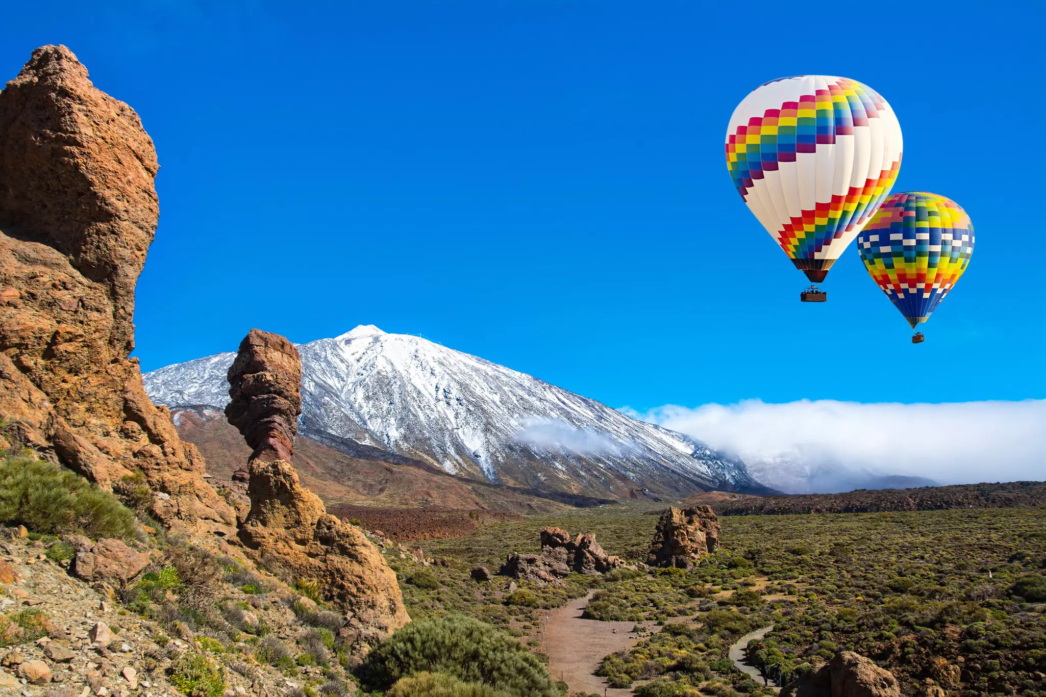 The Roque Cinchado rock formation is an iconic feature of Teide National Park. Elena-studio / Getty Images