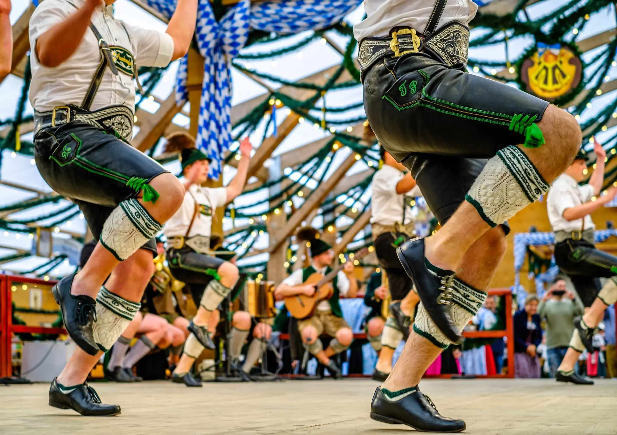 Typical bavarian dancers in traditional clothing at the Oktoberfest in Munich.