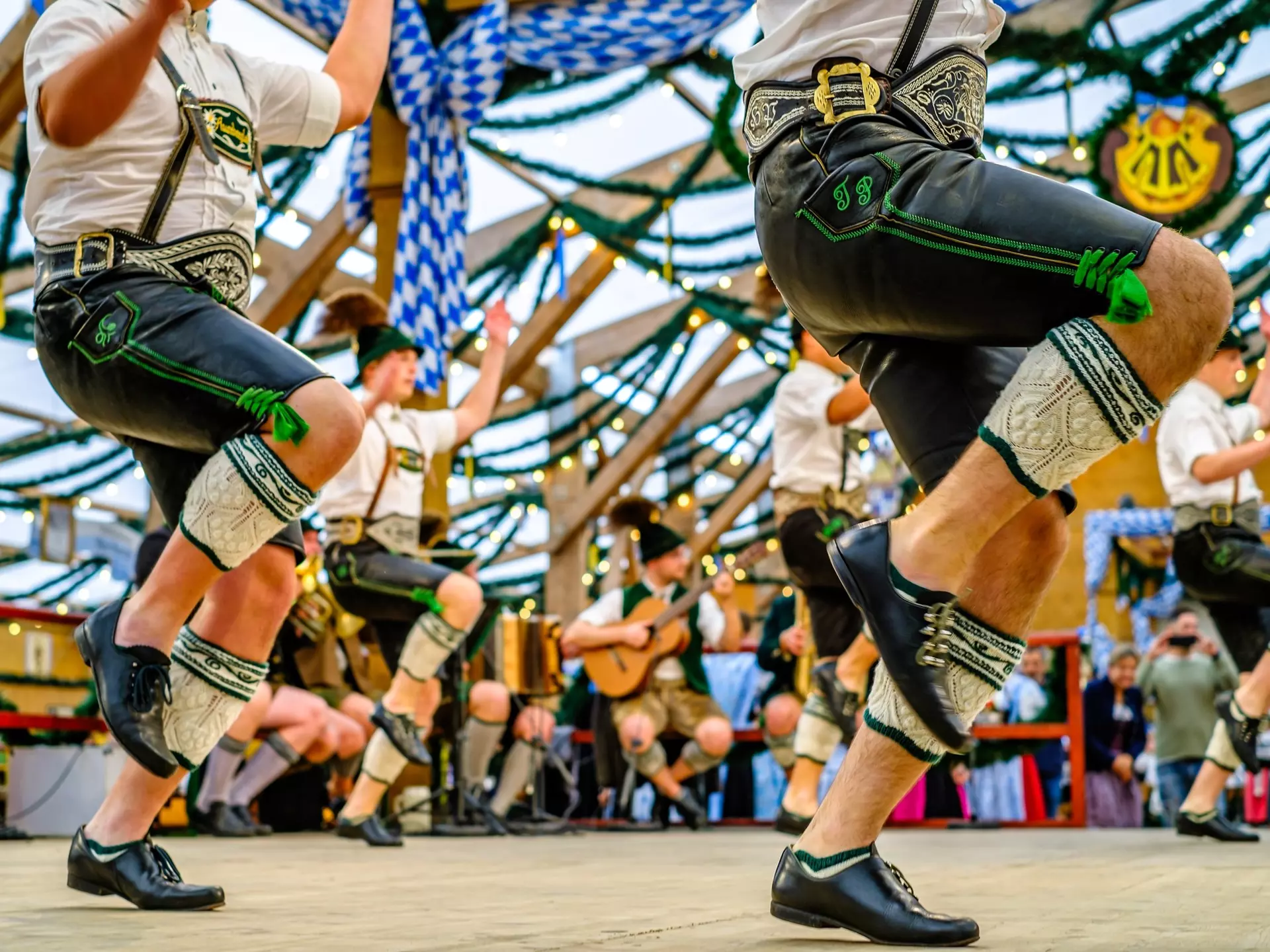 Typical bavarian dancers in traditional clothing at the Oktoberfest in Munich.