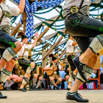 Typical bavarian dancers in traditional clothing at the Oktoberfest in Munich.