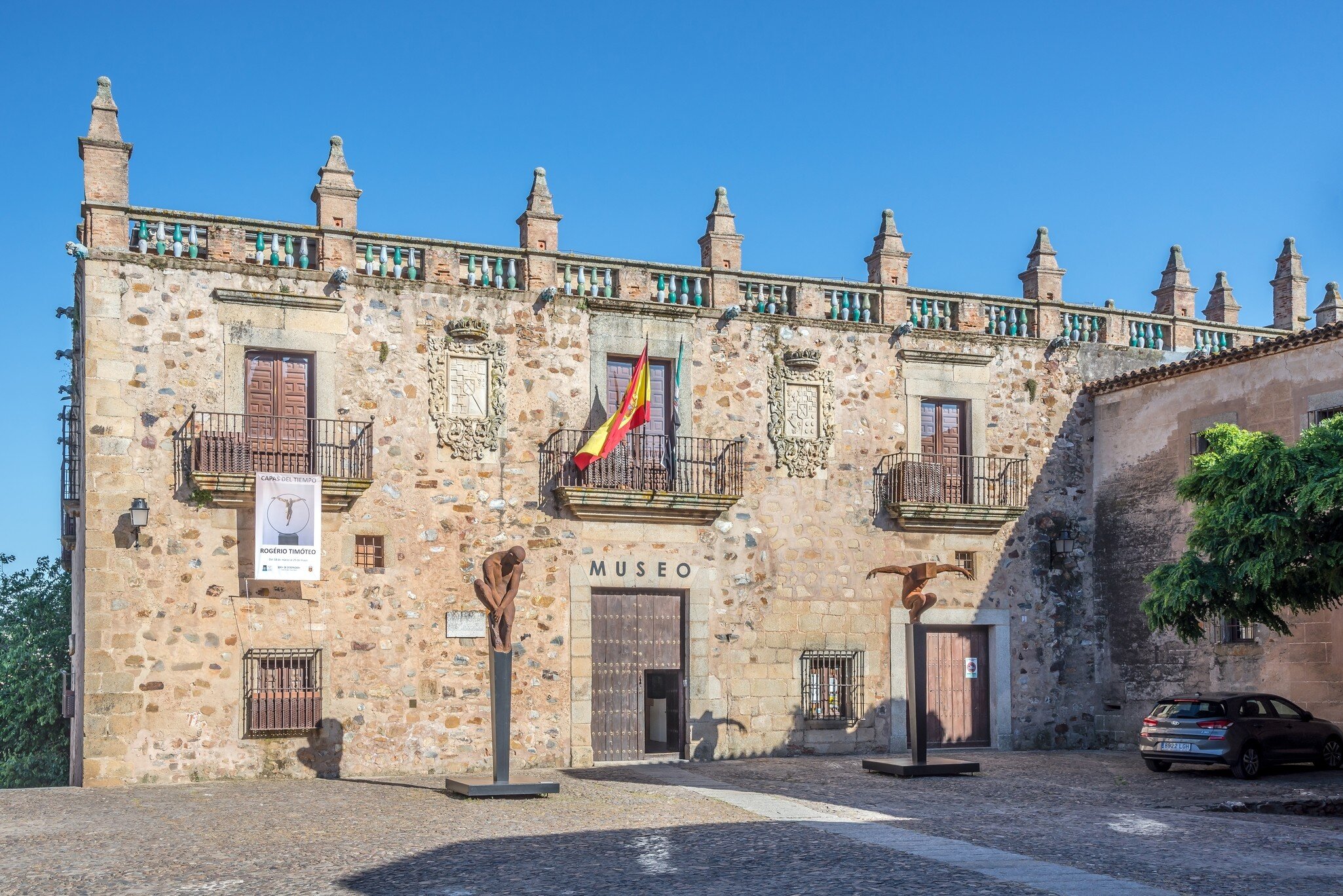 View of the Museo de Cáceres on a sunny day in Spain.