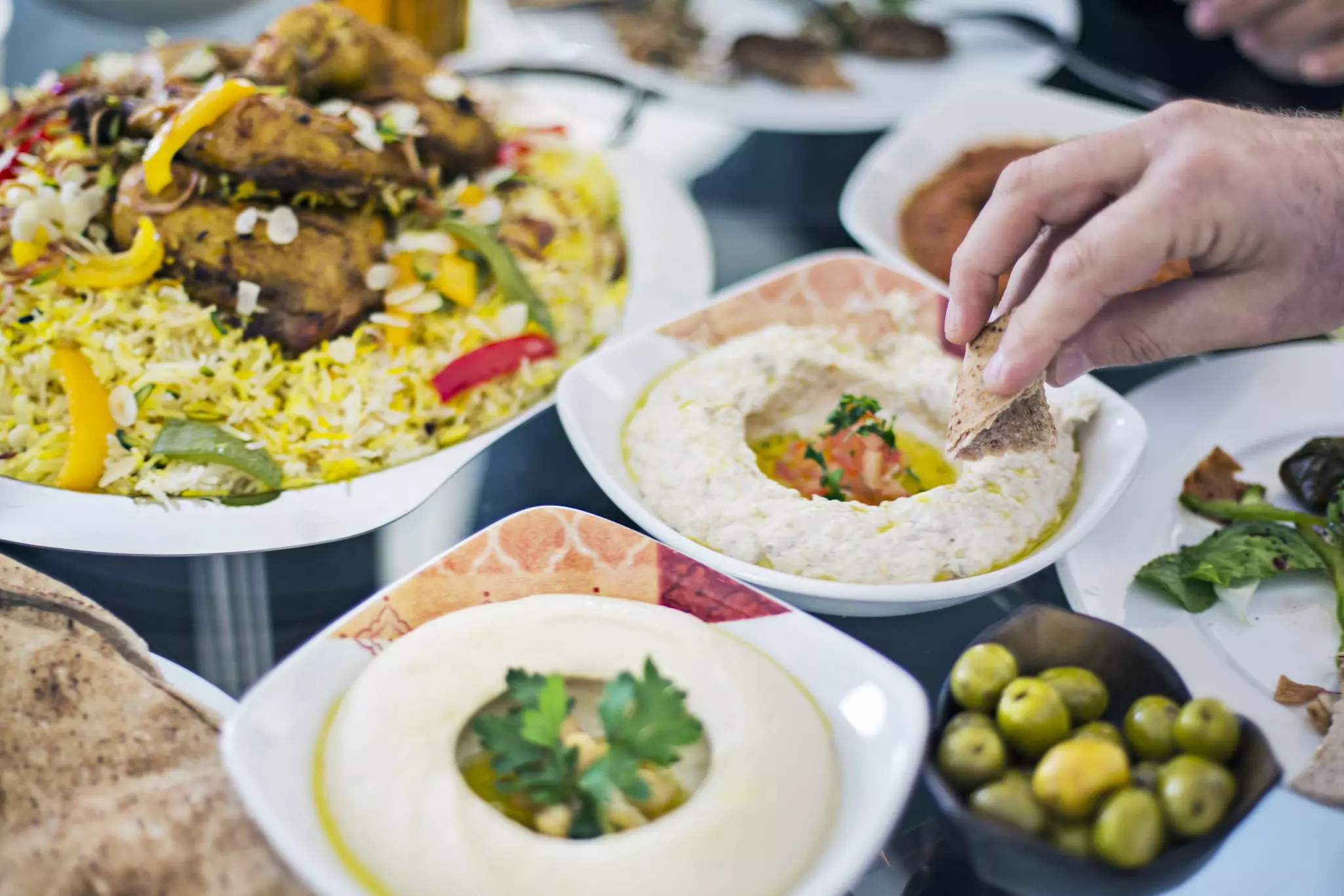 Dinning table filled with different mezze in Dubai.