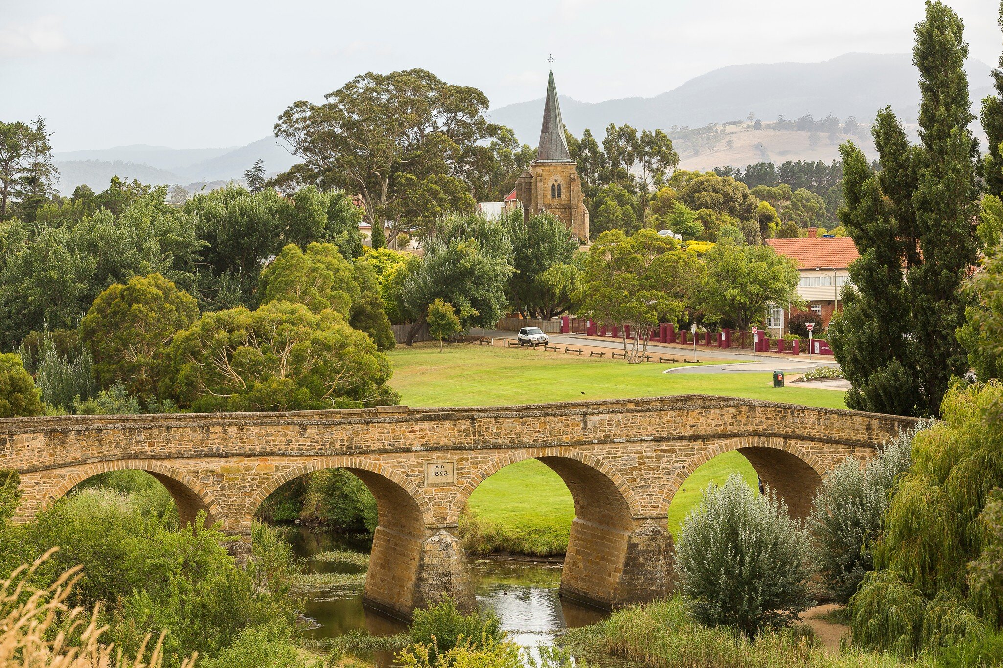 View of Richmond Bridge surrounded by greenery in Richmond, Tasmania.