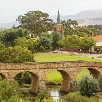 View of Richmond Bridge surrounded by greenery in Richmond, Tasmania.