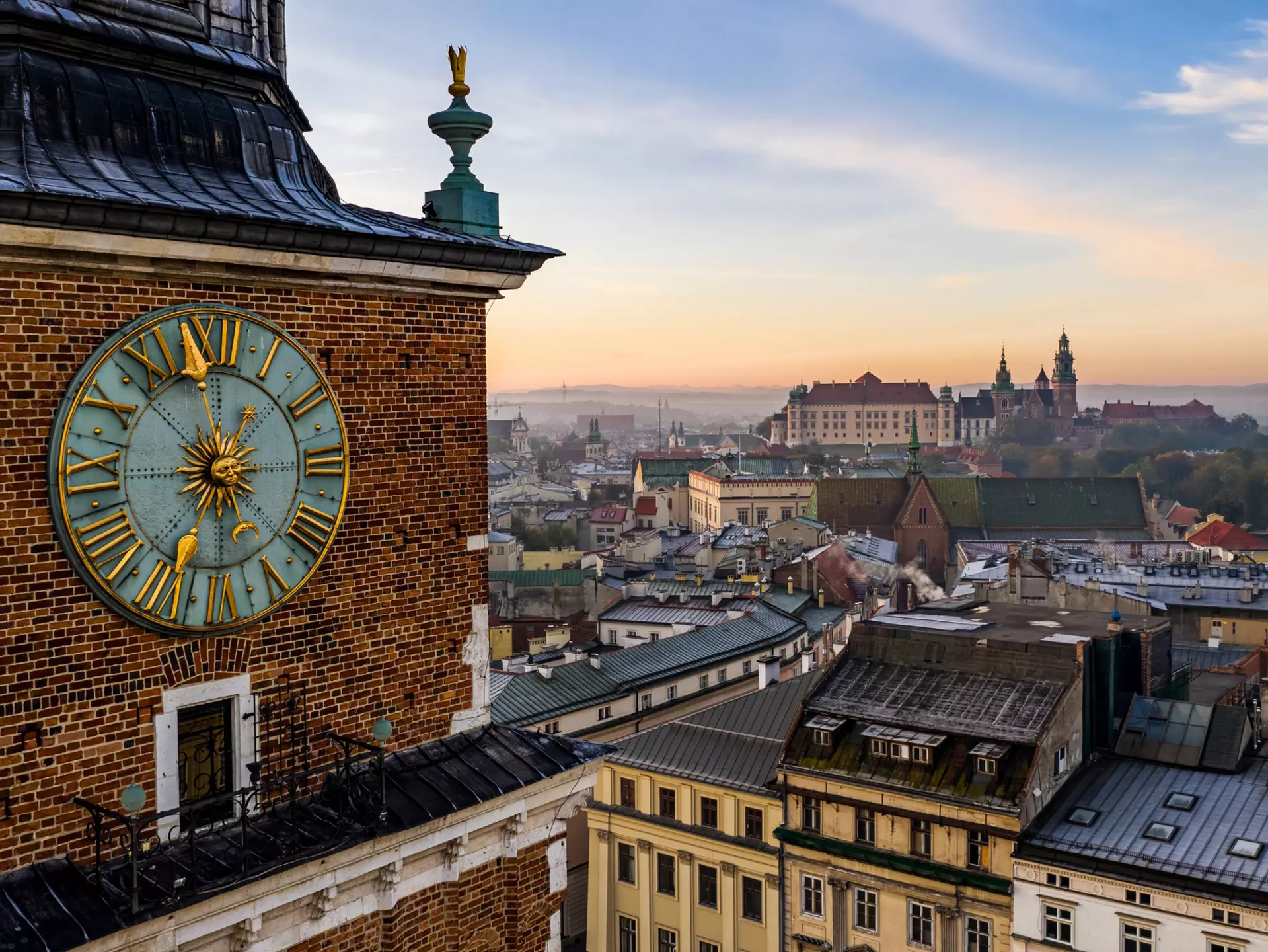 The Town Hall Tower and Wawel Royal Castle. Daniel Turbasa/Shutterstock