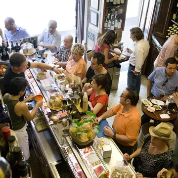 People at Quimet i Quimet tapas bar in Poble Sec ©Michael Heffernan/Lonely Planet