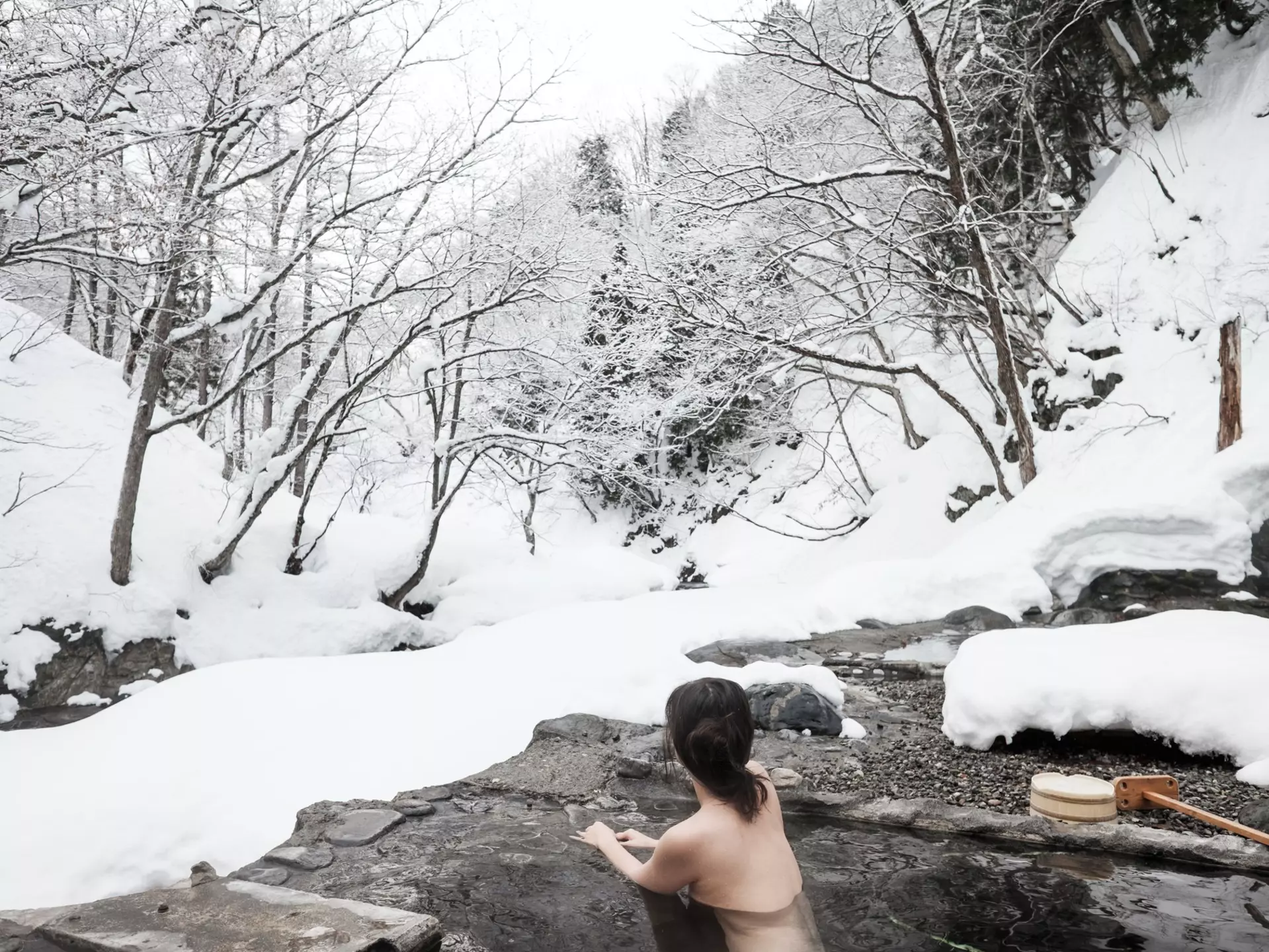 Visiting an onsen during winter is particularly beautiful when they're outdoors. Getty Images