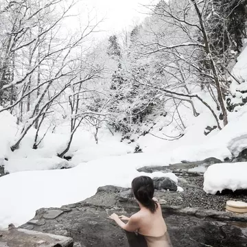 Visiting an onsen during winter is particularly beautiful when they're outdoors. Getty Images