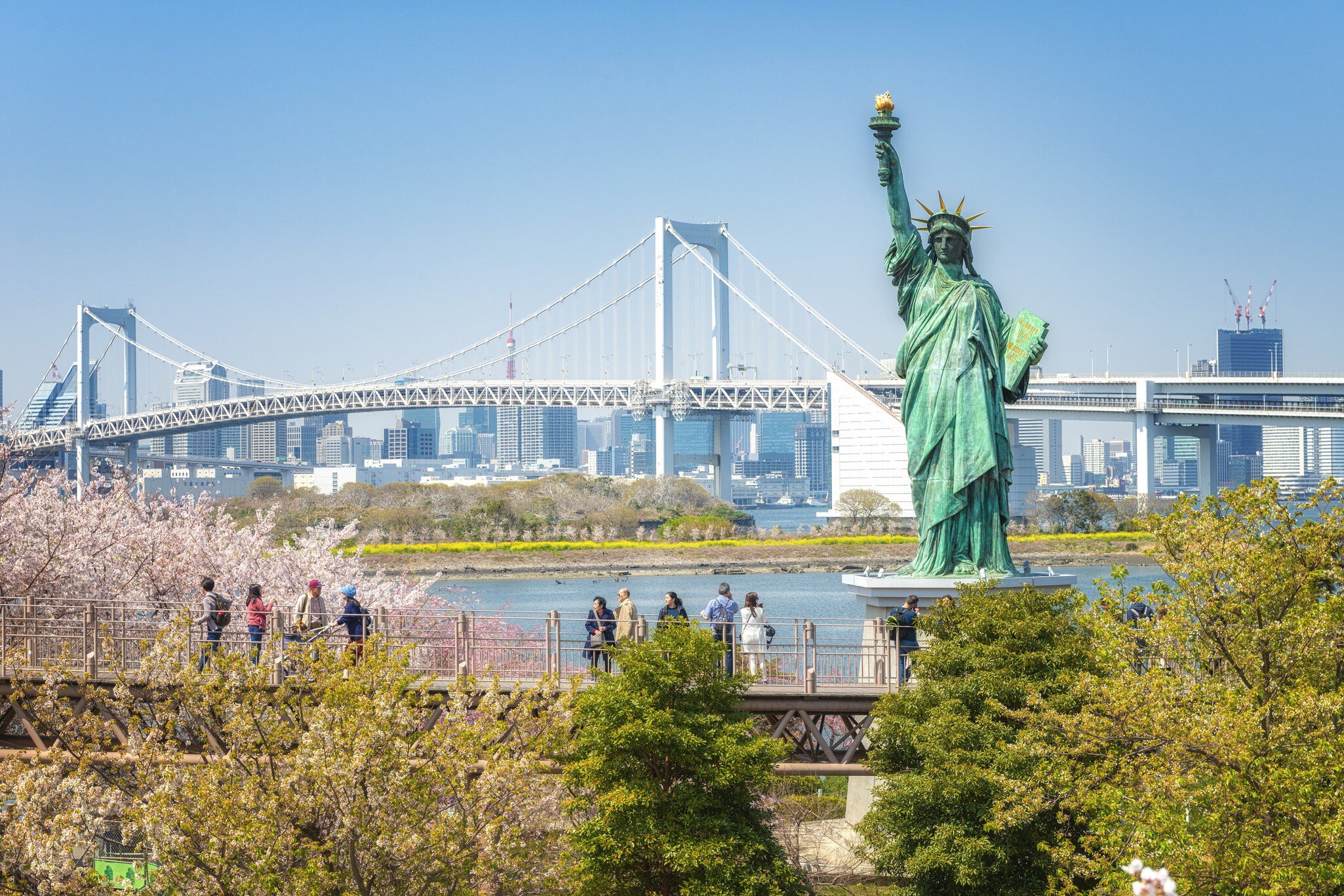 Statue of Liberty and Rainbow bridge in Tokyo Japan