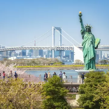 Statue of Liberty and Rainbow bridge in Tokyo Japan