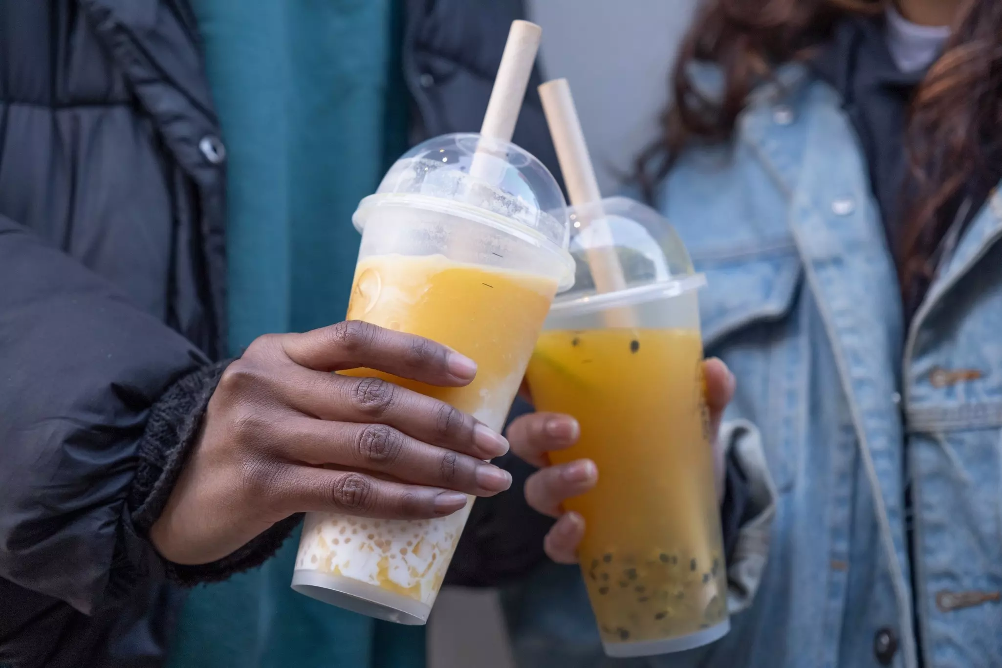Close up of two women holding bubble tea, License Type: media, Download Time: 2025-01-01T13:12:53.000Z, User: Norma.PrauseBrewer_LonelyPlanet, Editorial: false, purchase_order: 56530 - Guidebooks, job: Global Publishing WIP, client: London 14, other: Norma Brewer