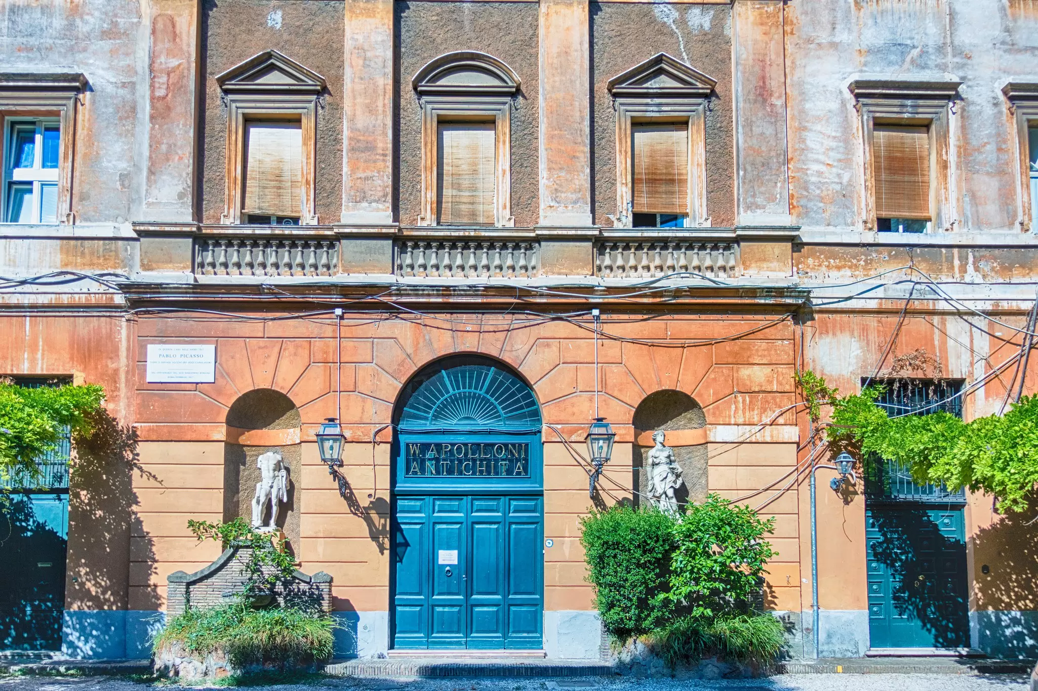Scenic street scene with a building with symetrical doors and windows