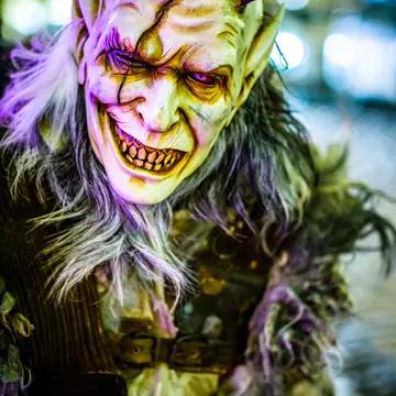 Closeup of a person dressed up in a ghoulish Krampus demon costume