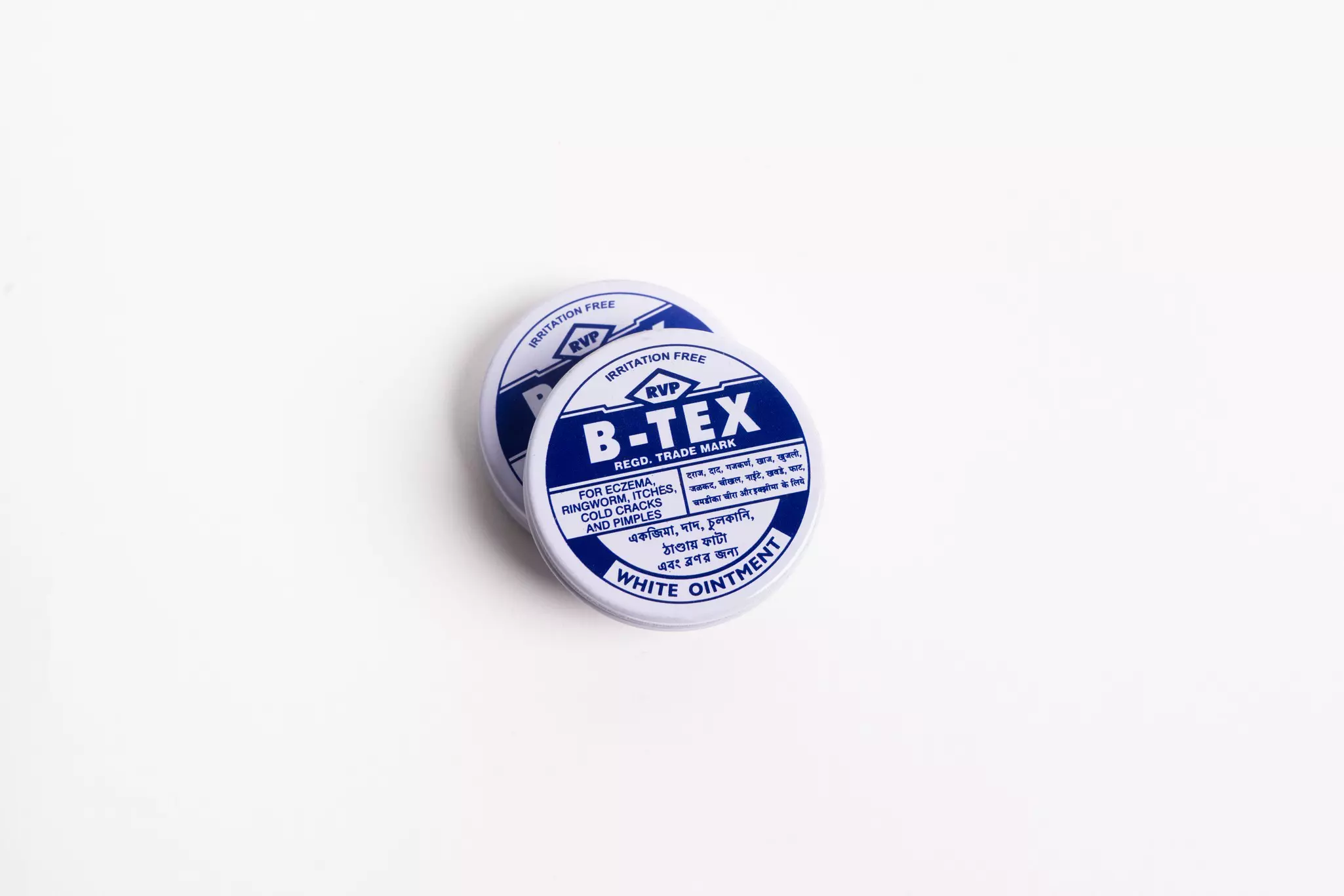 A tin of ointment. The tin is designed with blue and white text.