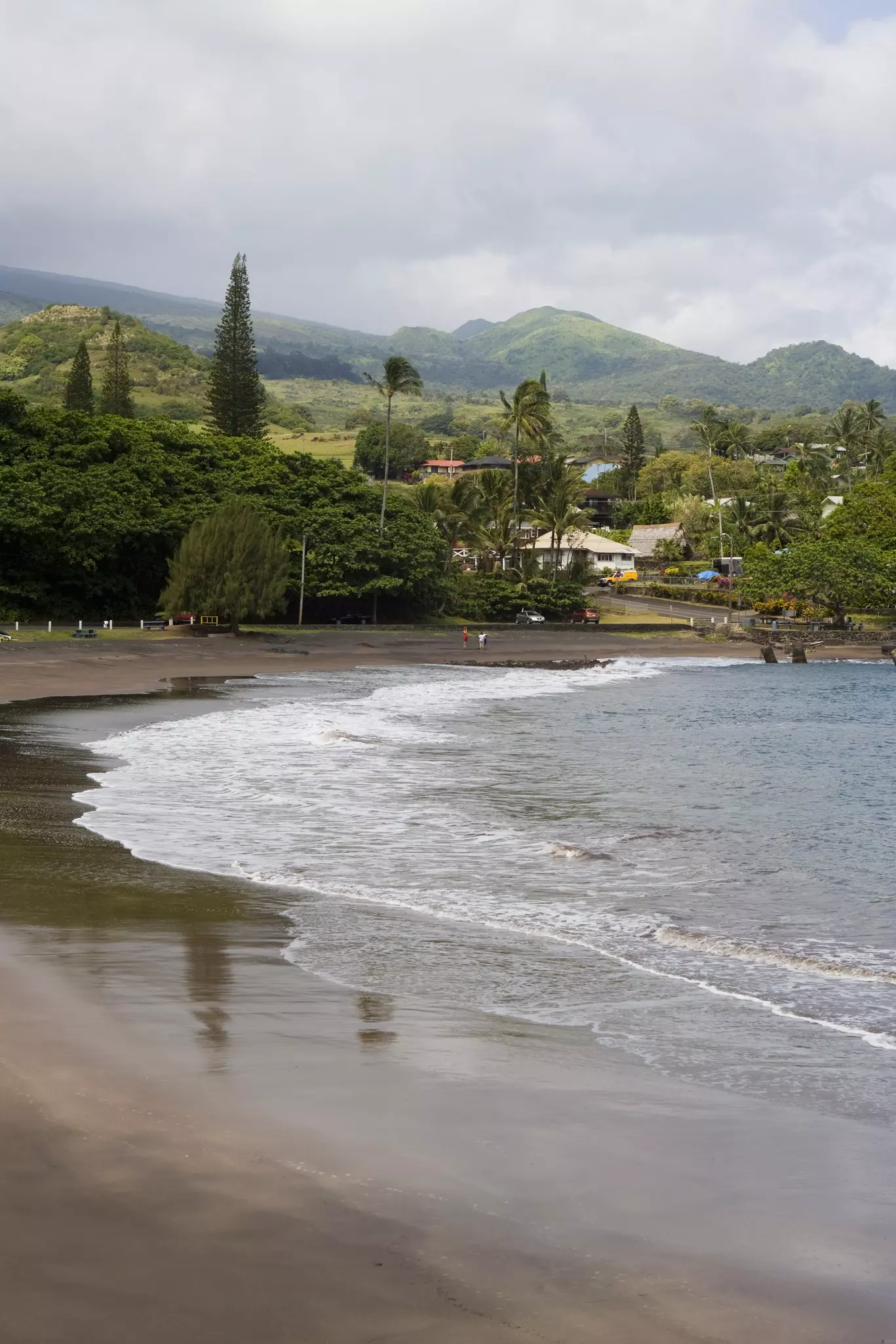 Hamoa Beach, Maui, with a few people in and around the water