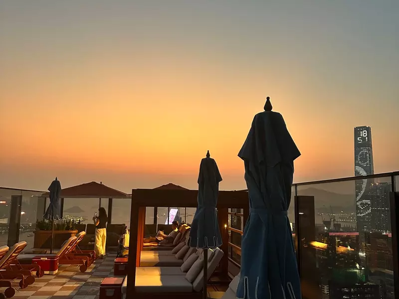 Loungers along the terrace during sunset at Swim Club, Hong Kong