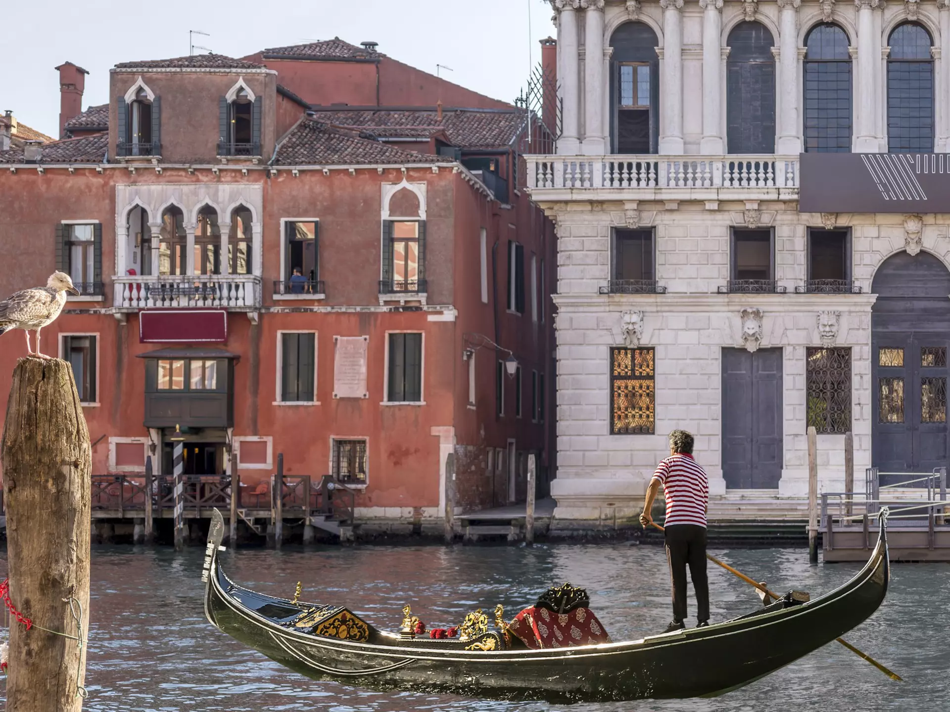 A gondola sails on the Grand Canal near the Hotel San Cassiano and the Prada Foundation