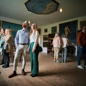 Visitors looking at artwork in the Johannes Larsen Museet, Odense, Denmark. 