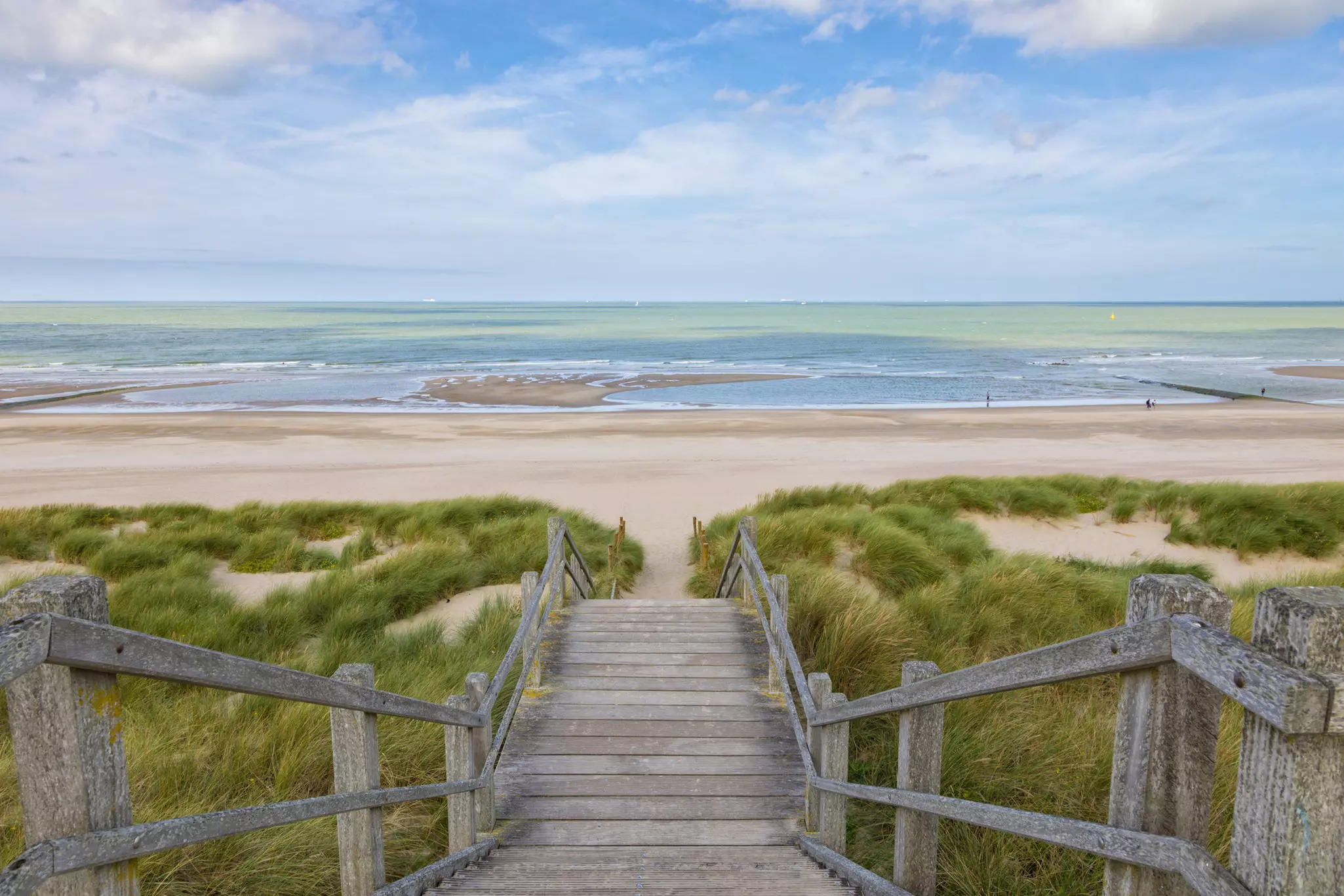 Wooden stairs down to a sandy beach