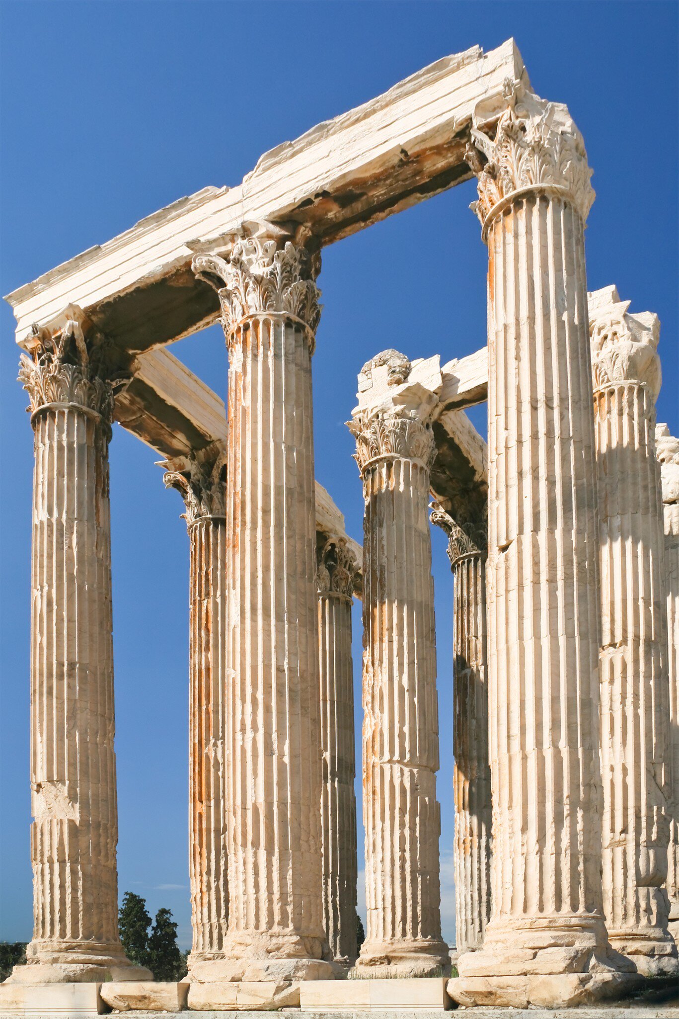 Colonnade of the Temple of Olympian Zeus in Athens on a sunny day with clear blue skies.