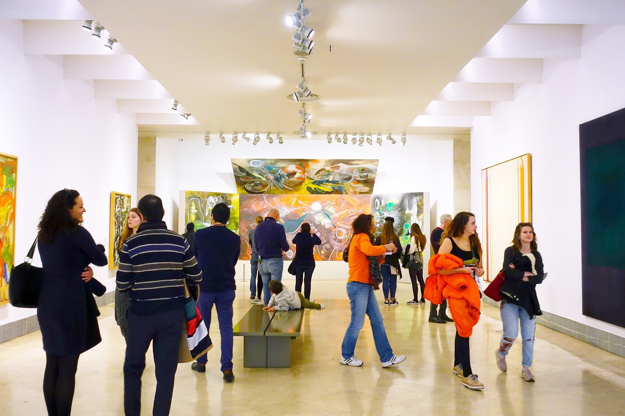 Visitors viewing paintings at the Thyssen-Bornemisza Museum in Madrid, Spain