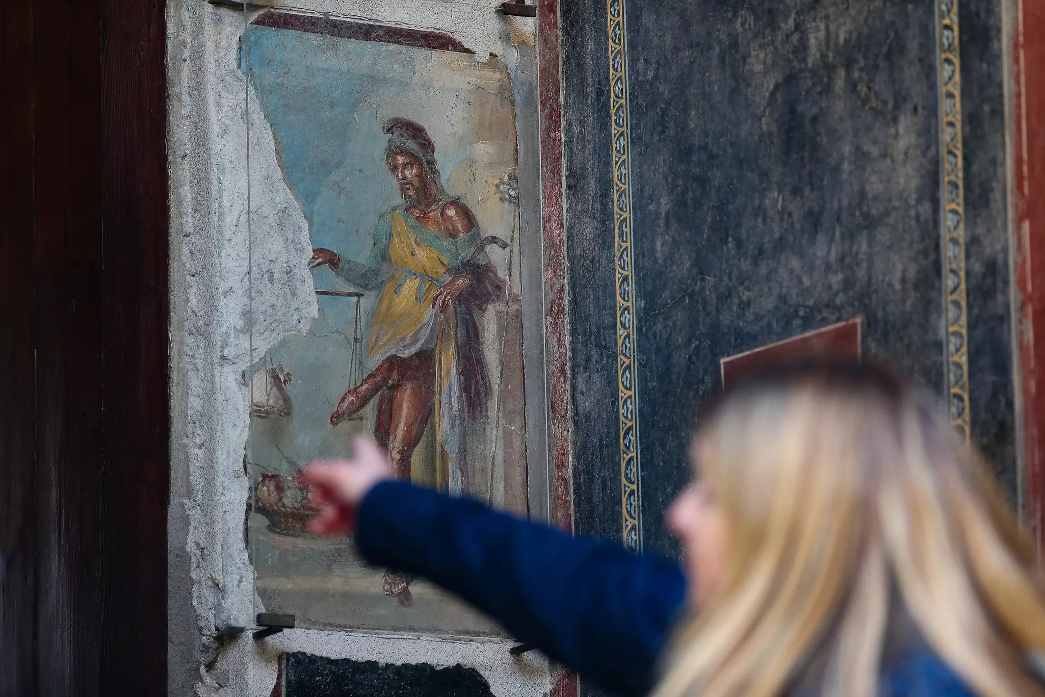 A woman points to Priapus © Marco Cantile/LightRocket/Getty Images