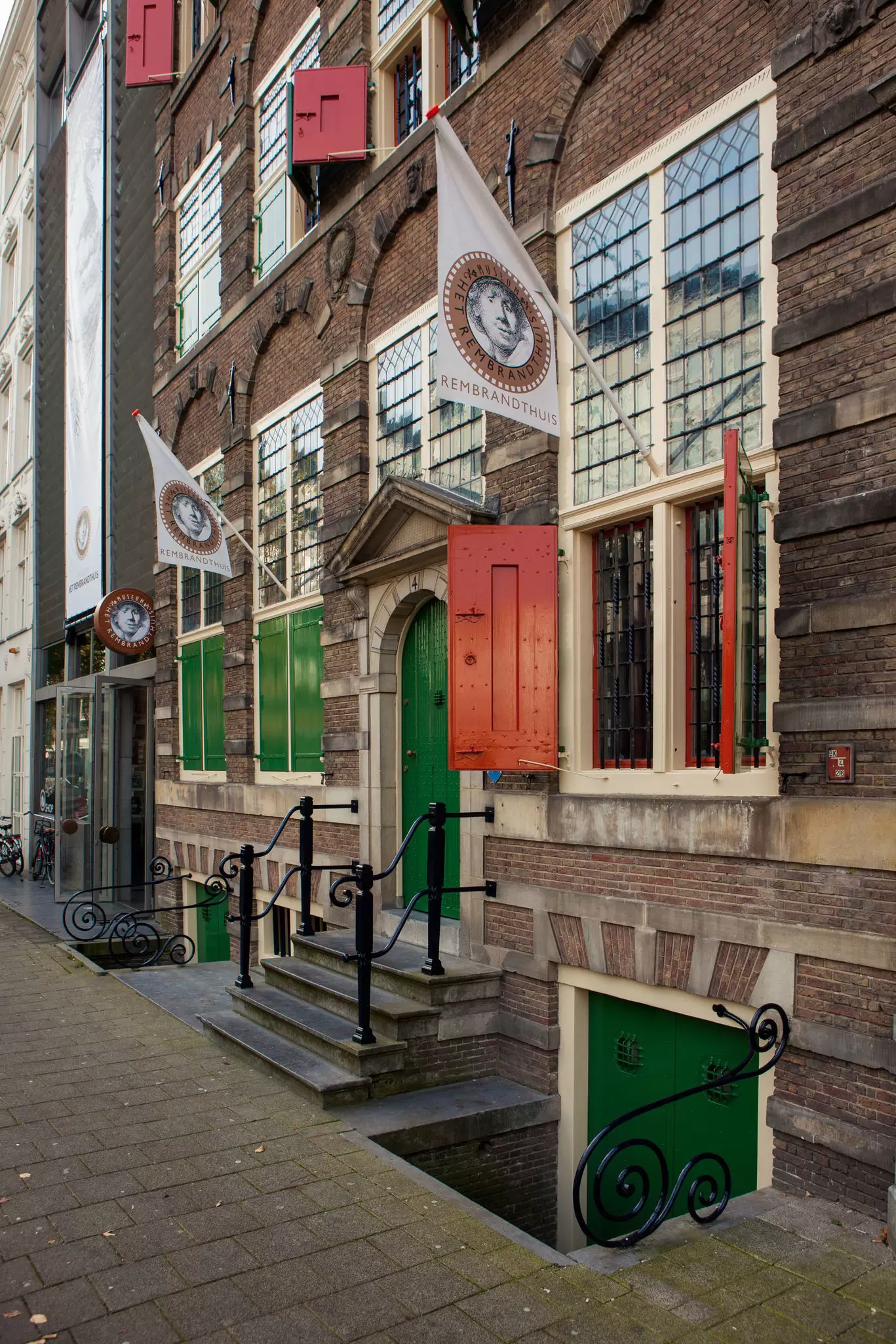 The green doors of the Rembrandt House Museum (Museum Het Rembrandthuis) entrance in Amsterdam, Netherlands