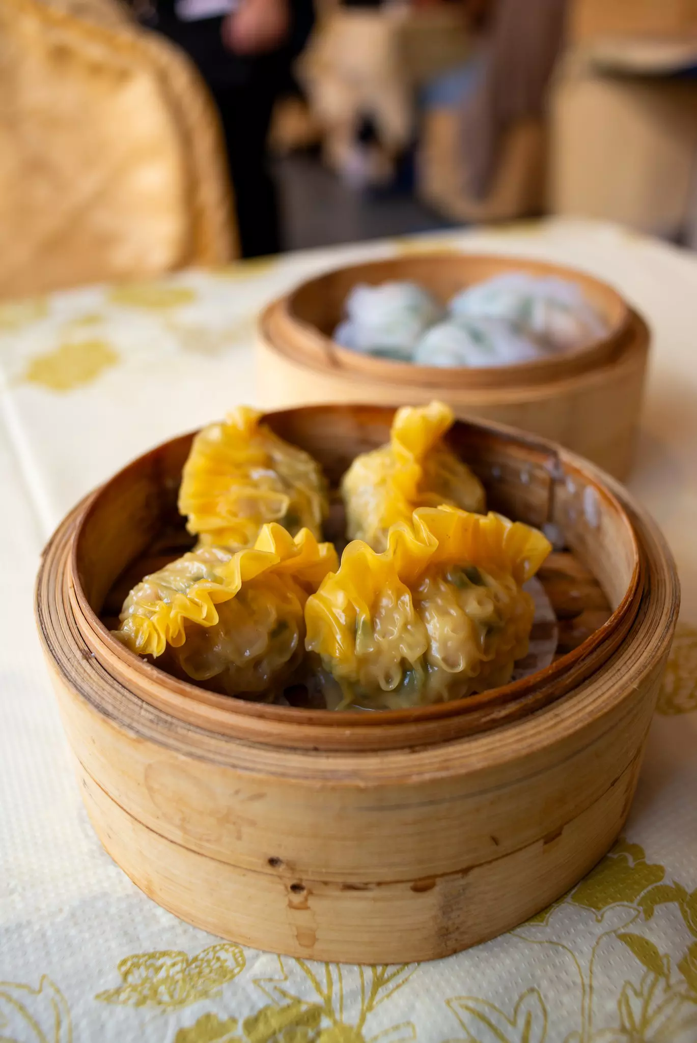 Crowds flock Hei La Moon, a sprawling, bi-level banquet hall-style dim sum emporium with traditional decor © Kimberly Maroon/Lonely Planet