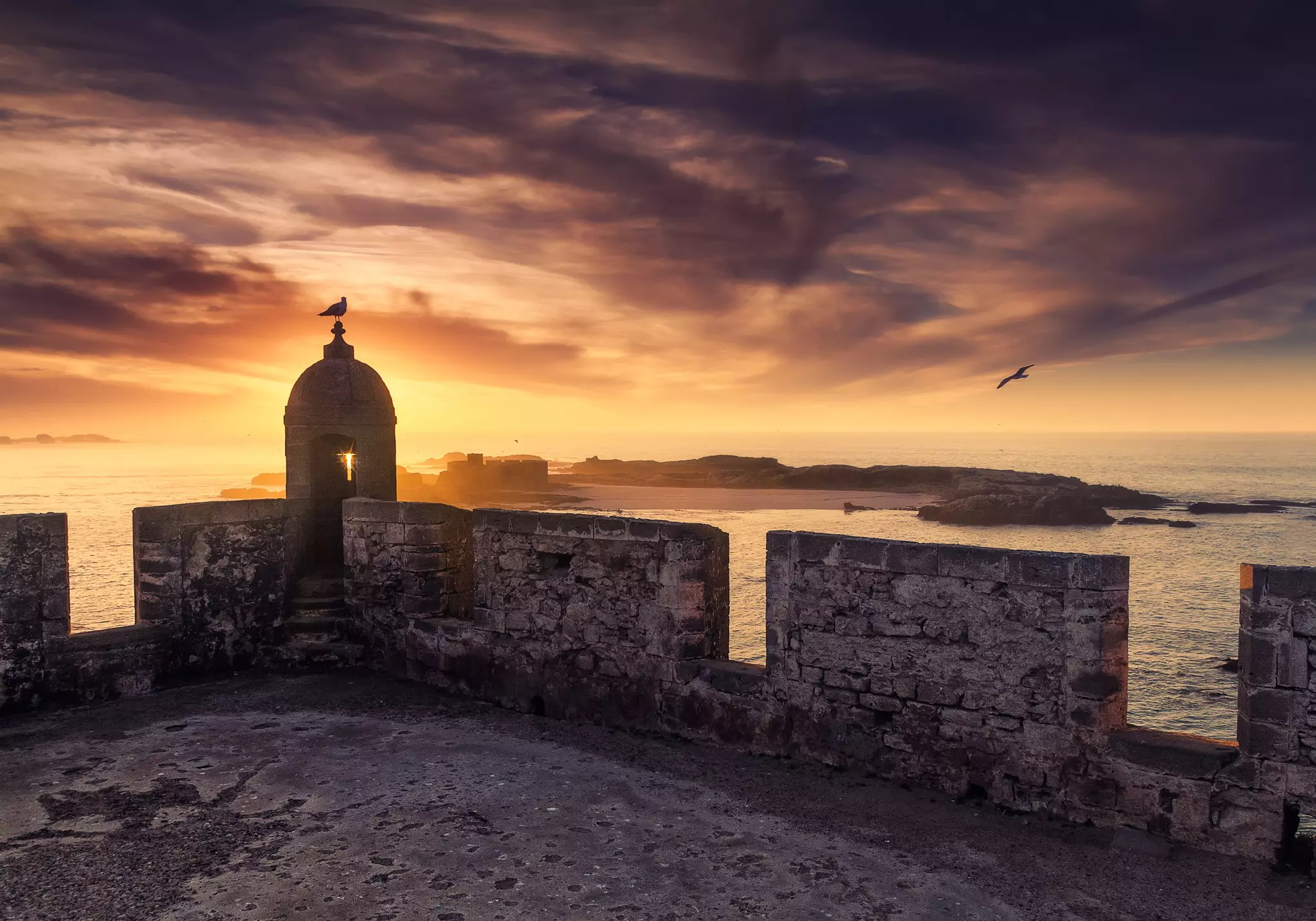 Sunset over the ramparts of Essaouira, Morocco.