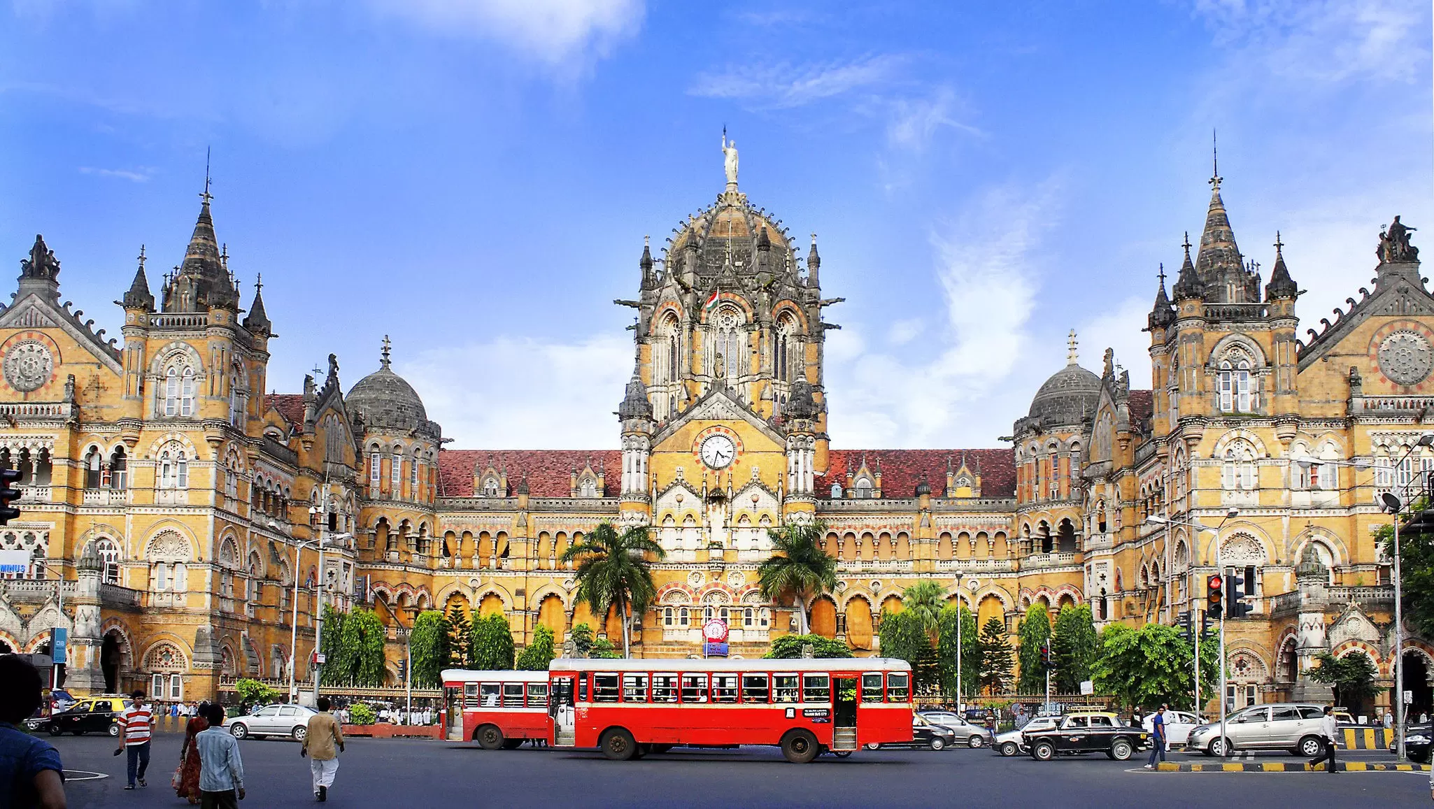 Buses pass the historic Chhatrapati Shivaji Maharaj Terminus in Mumbai, India.