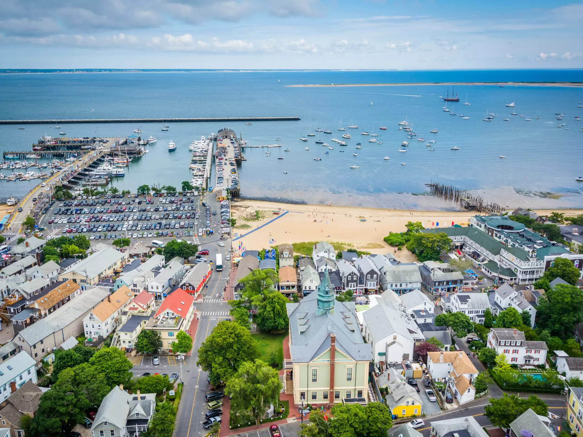 A beach, harbor and small town