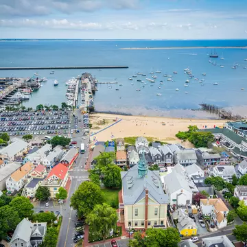 A beach, harbor and small town