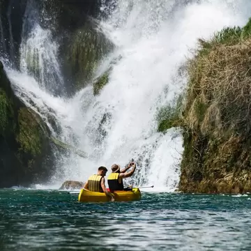 The idyllic Kravica Waterfall provides cool relief from the sweltering summer heat © Getty Images