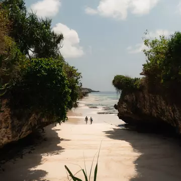 GettyImages-2211146675.jpg
Two tourists walking on a beautiful white sand beach surrounded by rocks and vegetation in zanzibar, tanzania
Tourists walking on a secluded beach in zanzibar, tanzania