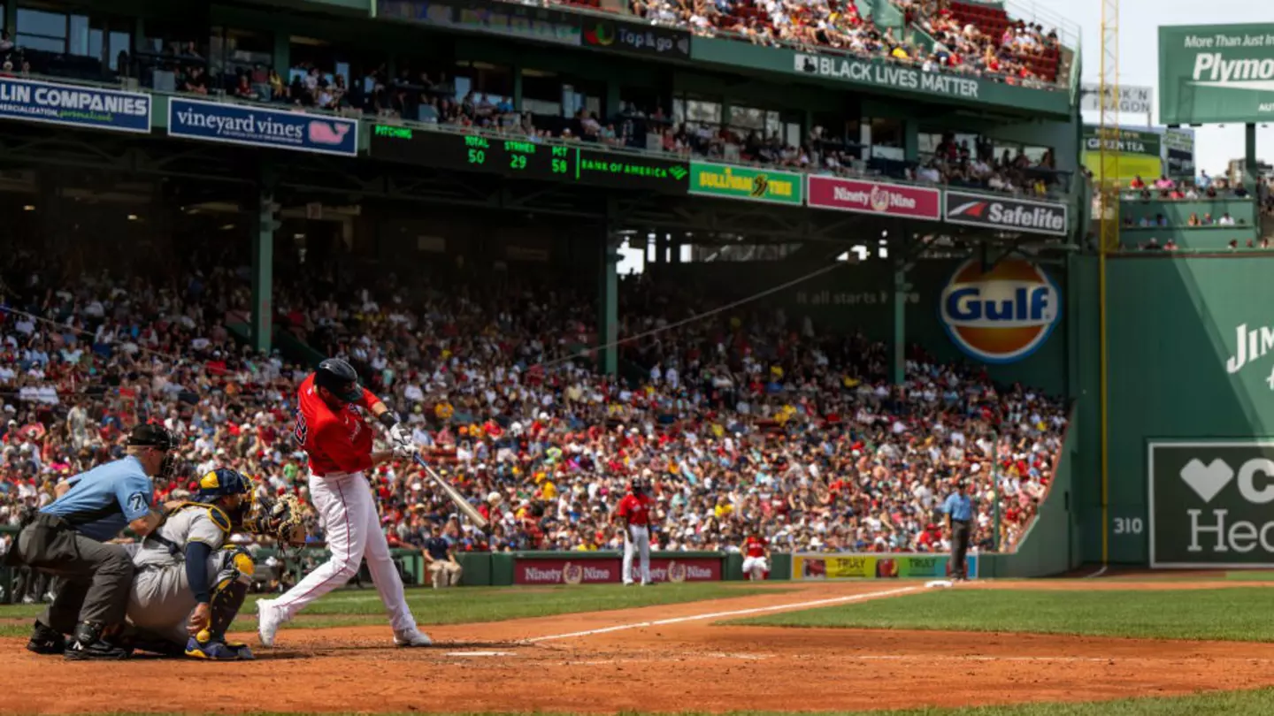 J.D. Martinez #28 of the Boston Red Sox hits a double during the fourth inning of a game against the Milwaukee Brewers on July 31, 2022 at Fenway Park in Boston, Massachusetts.