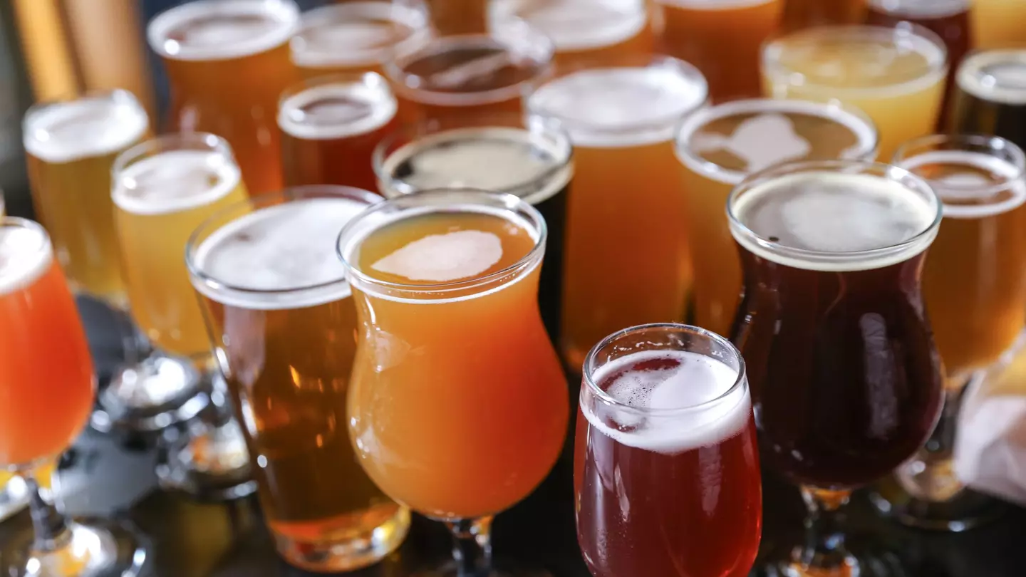 A cluster of glasses holding different varieties of craft beer