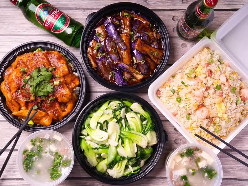 A spread of bowls of various dishes from Mala Sichuan Bistro
