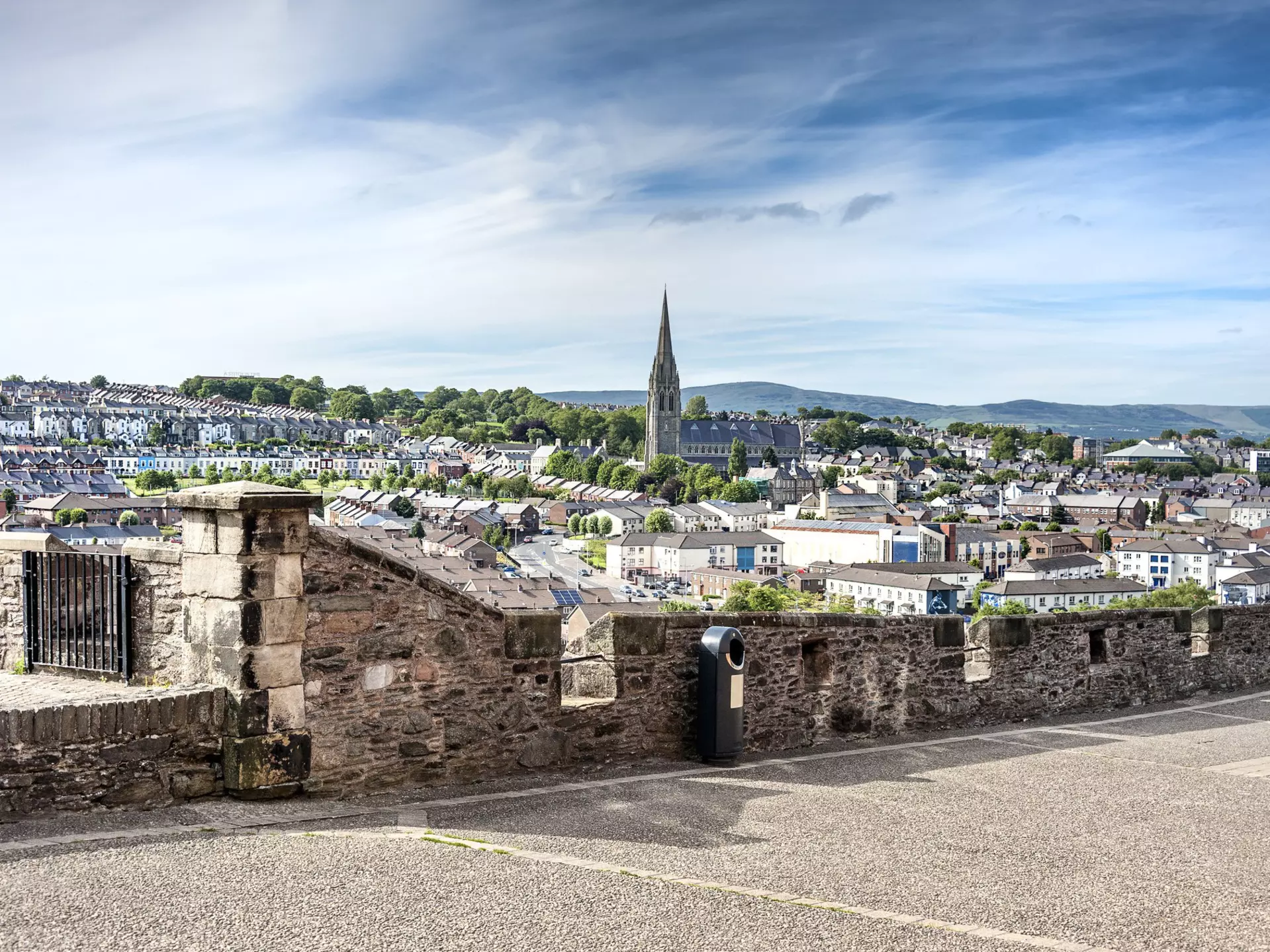 The skyline of Derry with St Eugene's Cathedral near Free Derry Corner and the city wall