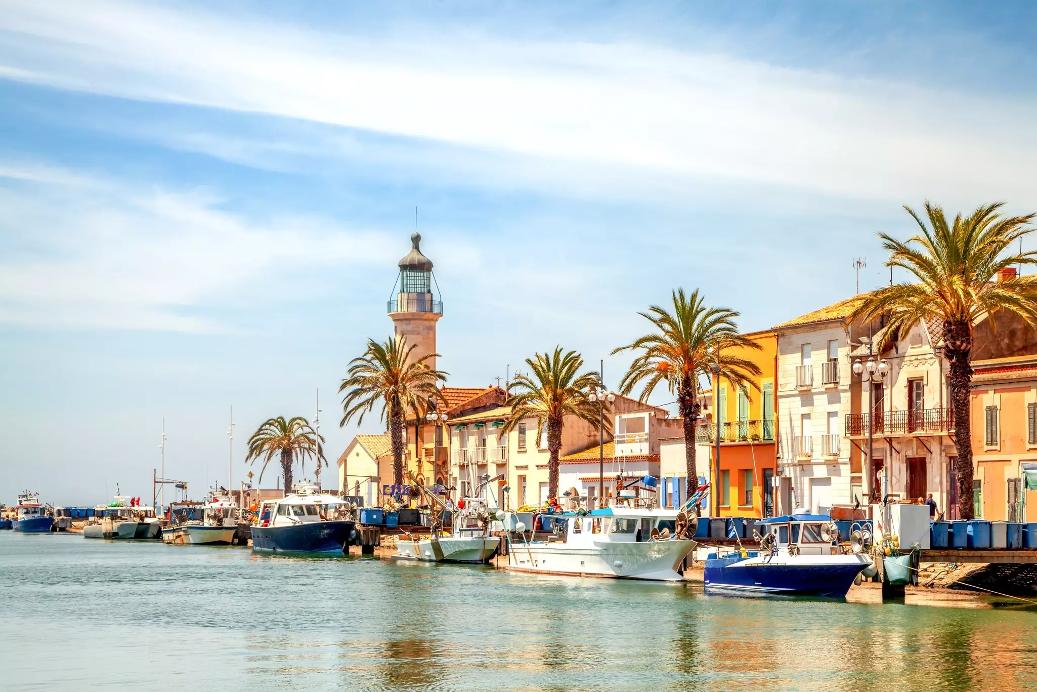 Boats line the waterfront in the historic port in La Grau-du-Roi, France. 