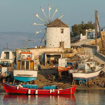 Shipyard and windmill at sunset