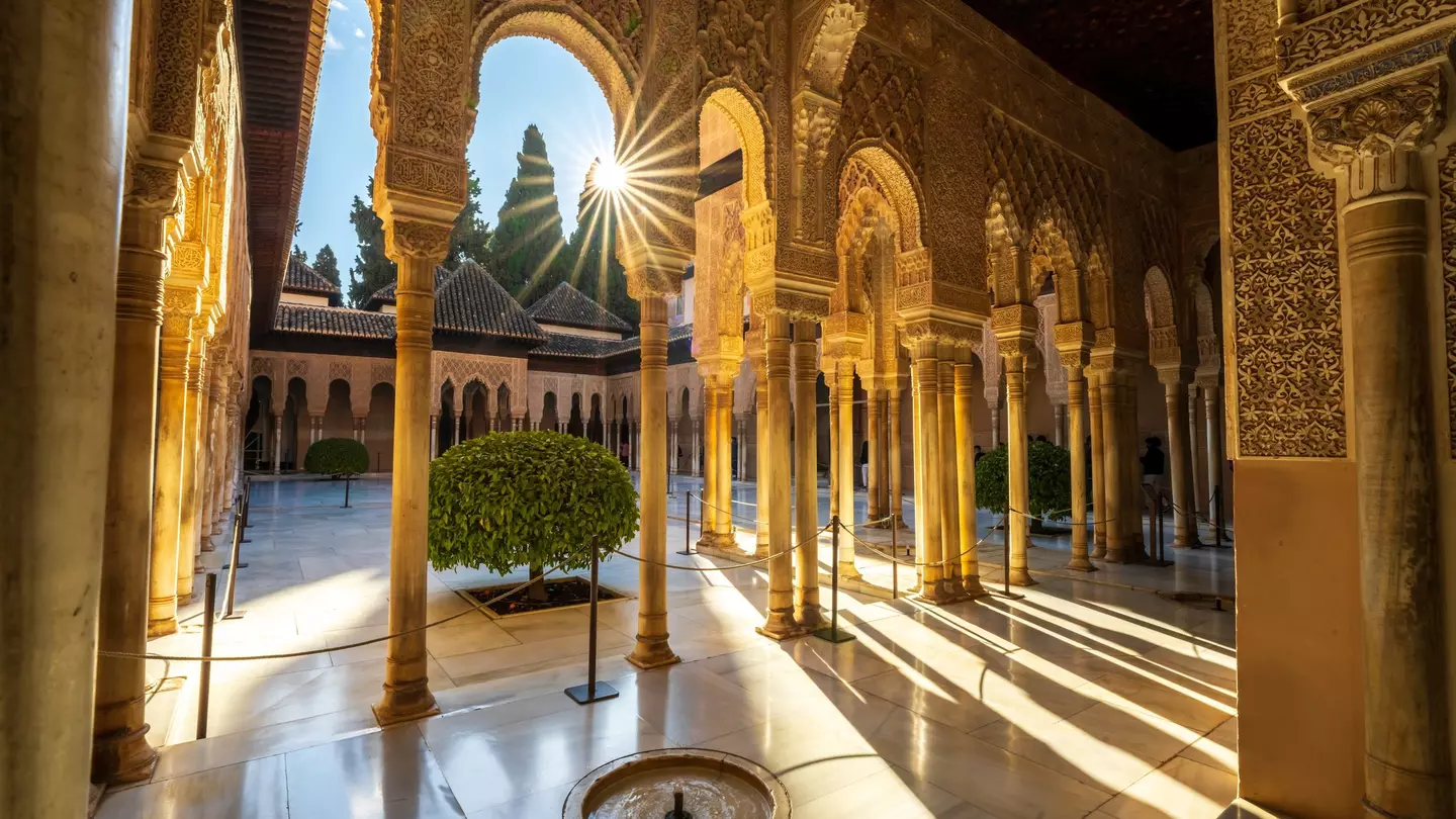 Granada, Spain, EU - March 6, 2022. Inside Alhambra Palace, interior patio courtyard, Court of the Lions with Moorish arched pillars, columns, fountain and starburst, day. A Alhambra Nasrid Palace., License Type: media, Download Time: 2024-10-03T06:33:45.000Z, User: claramonitto, Editorial: true, purchase_order: 56530, job: Global Publishing-WIP, client: Experience Andalucia 2, other: Clara Monitto